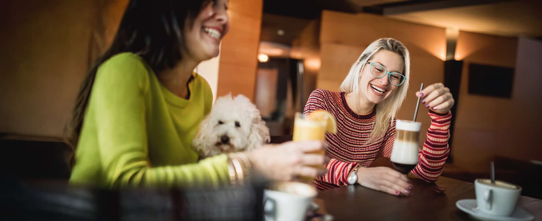 Two women enjoying beverages together