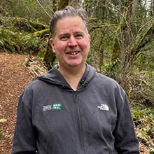 Timothy Wortman outside on a trail