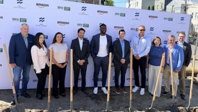 Group of people standing with shovels outside