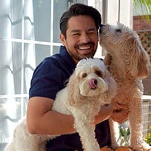 Mike Cruz playing with his dogs